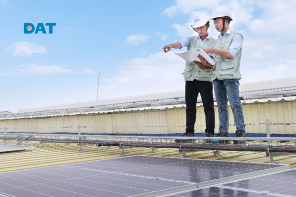 Solar panel installer working on rooftop solar system installation