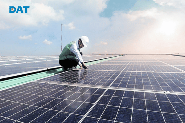 Solar panel installer working on rooftop solar system installation